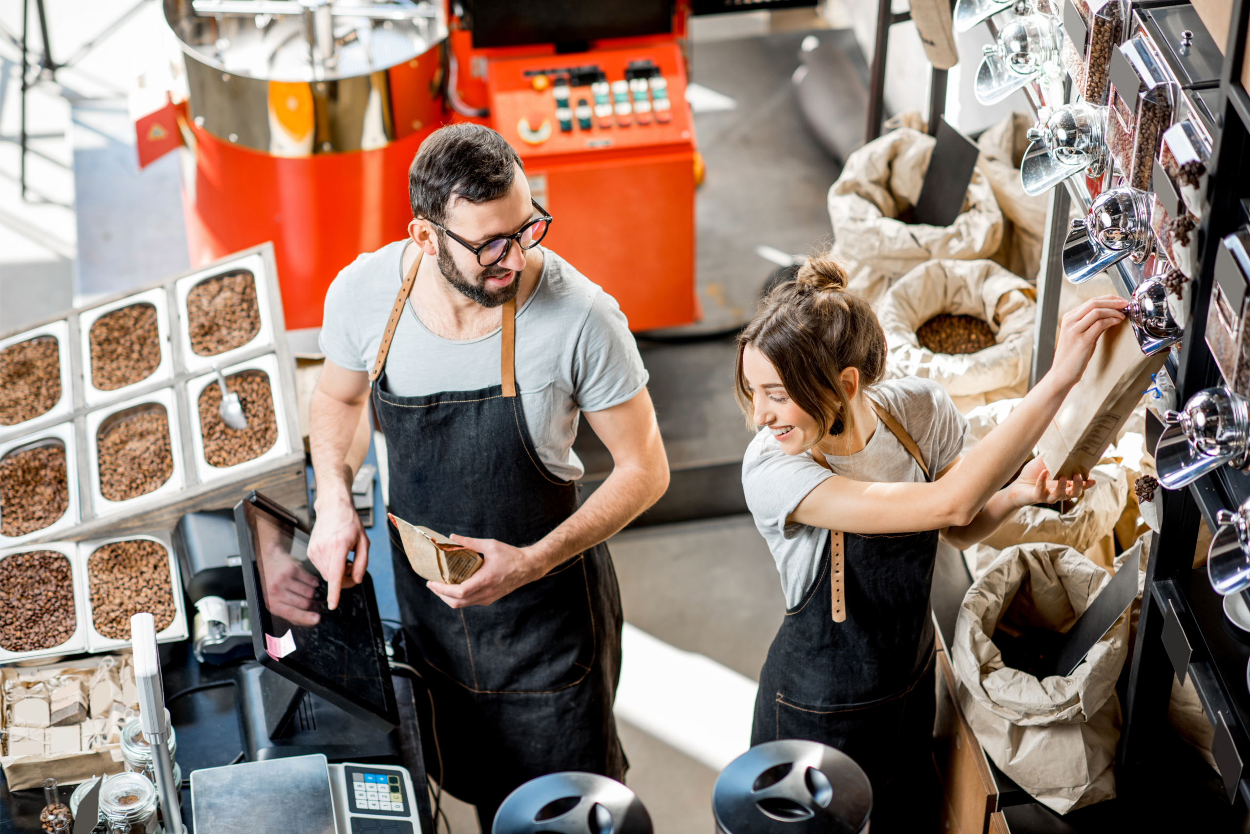 Coffee workers packaging and labeling coffee products