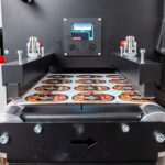 Automatic web guide keeps label material straight without collars