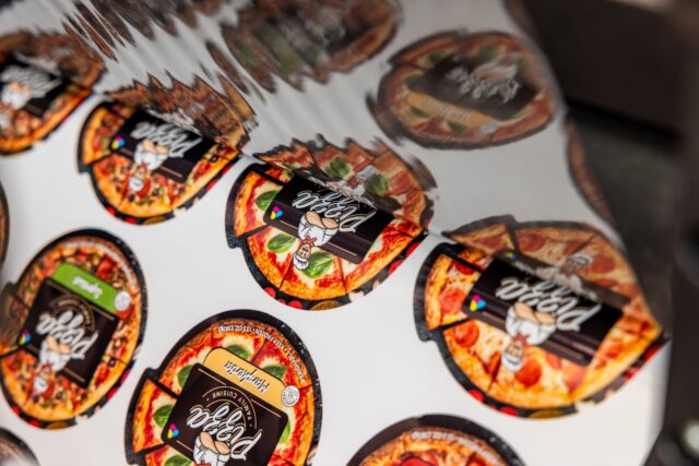 Labels being laminated before digital cutting