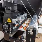 Slitting labels down to narrow individual rolls