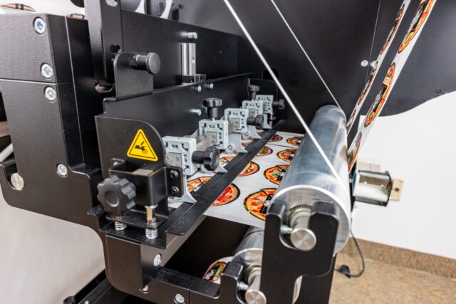 Slitting labels down to narrow individual rolls