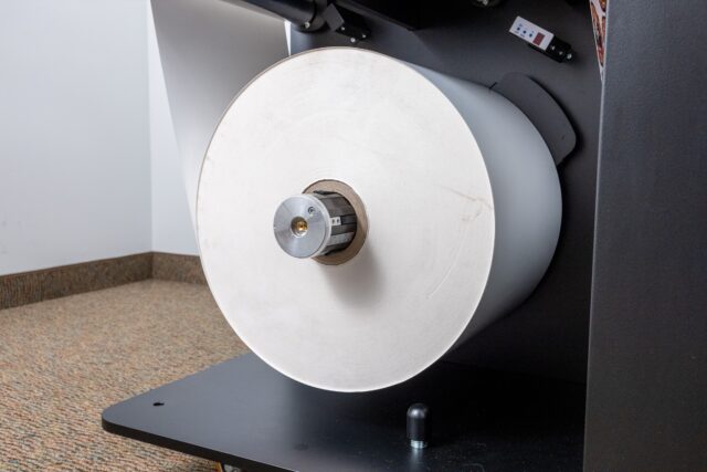 Large input roll either pre printed or blank labels